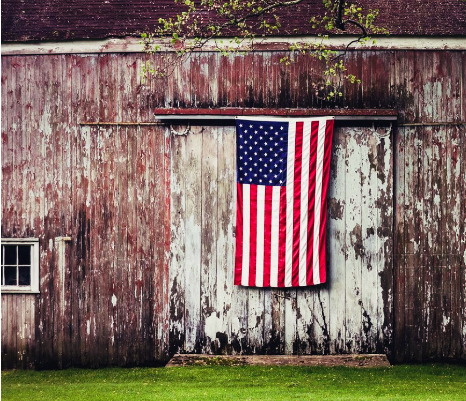American flag hanging on barn door