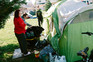 A community officer visiting an encampment in Grants Pass, Ore., in March. 