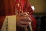 Image of a priest holding someone's hands