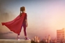 Image of a child wearing a superhero cape