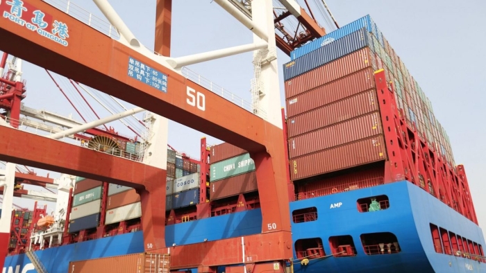 A CSCL Autumn cargo ship carrying containers stop at Qingdao Port on April 8, 2018 in Qingdao, Shandong Province of China. China has announced that it will slap tariffs on $60 billion in U.S. imports in retaliation for Trump administration tariffs.