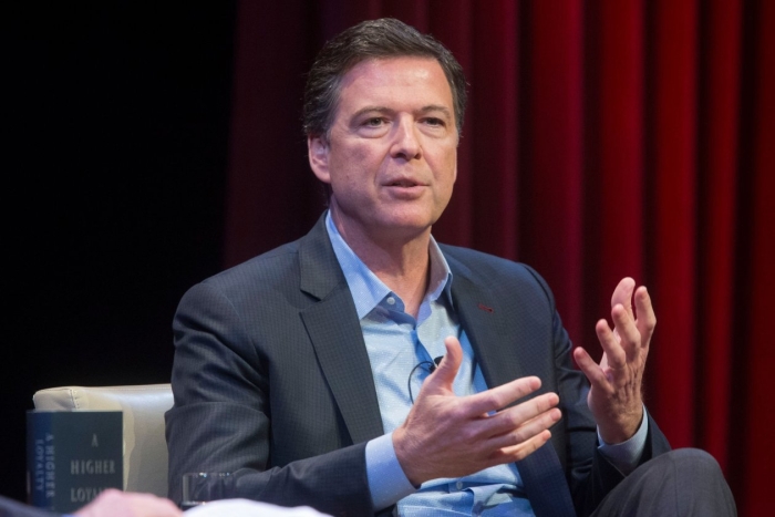 The report by the Justice Department’s inspector general found that former FBI Director James Comey, shown here on April 30, deviated from policies in speaking publicly about the investigation of Hillary Clinton’s use of a private email server at a news c